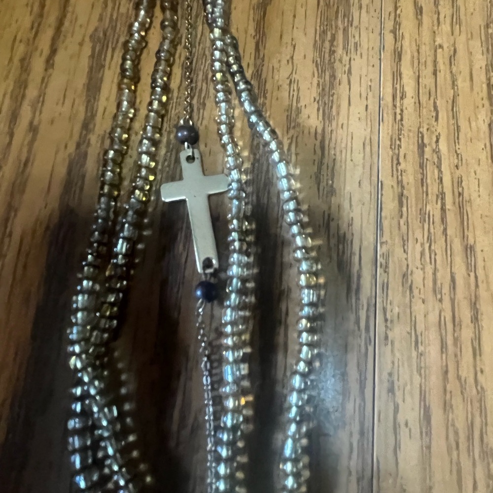 Gold beaded and plated Bracelet with Cross Charm.